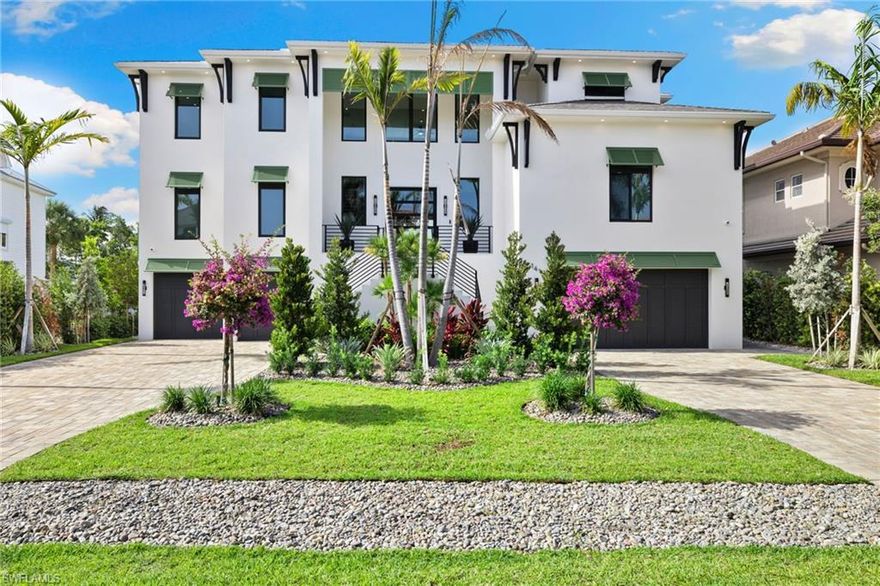 The home you have been waiting for is here! Welcome to your dream home in the prestigious resort-style Conners at Vanderbilt Beach community. This stunning custom-built, move in ready,  turnkey, single-family home, built in 2024 and located at the end of a cul-de-sac, boasts 5 bedrooms, 7 baths, and a spacious 4 car garage with ample storage. All bathroom windows have frost feature for added privacy. Relax, unwind, entertain on one of your expansive outdoor living areas or play by poolside in your private pool and spa that overlooks the sparkling waterfront.Your outdoor kitchen features a BBQ grill, smoker, deep fryer, pizza oven, griddle, refrigerator, and ice maker. Bring your boat and jet skis! Your private dock gives you the convenience of quick access to the gulf and fun water activities. From the moment you enter into your grand 2 story foyer; you will see what luxury affords. The interior welcomes you with wide plank white oak engineered hardwood flooring throughout, and features luxury furnishings, high-end finishes and lighting, private elevator, main floor primary bedroom with en suite, second floor primary bedroom with en suite, two separate family/ living rooms (one on main level and one on the second floor), open dining area, sound system, and first and second floor laundry rooms. The open concept kitchen offers timelessly elegant quartz countertops, premium appliances (including a built-in gourmet coffee maker) and an oversized pantry. Located near Vanderbilt Beach, La Playa Beach and Golf Resort, The Ritz Carlton, Delnor-Wiggins State Park, Mercato and Waterside shoppes. Come live the life of luxury you deserve at Conners at Vanderbilt Beach.