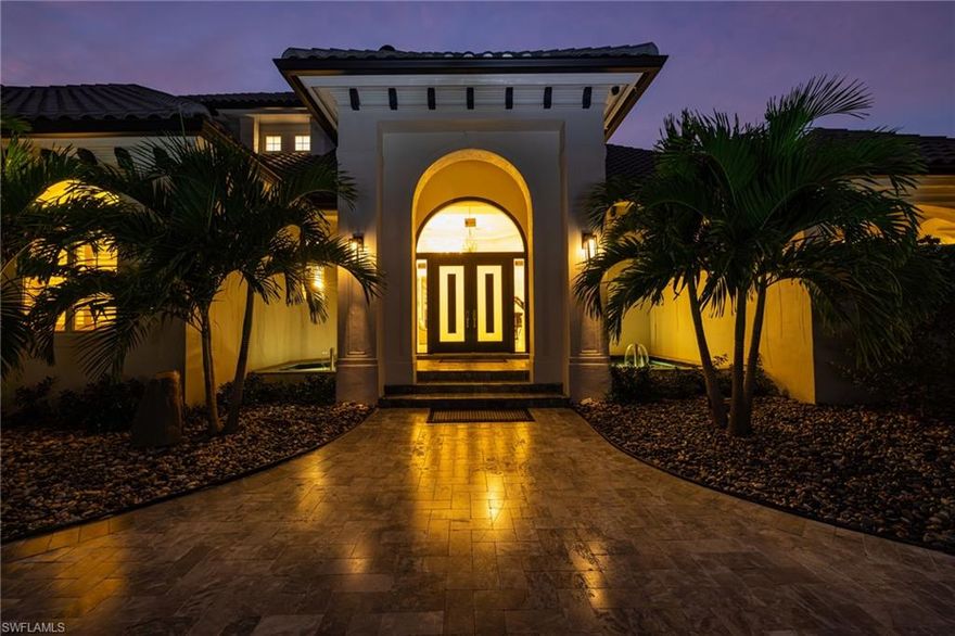 Set within the prestigious West Bay Club, this exceptional estate delivers a rare combination of privacy, scale, and sweeping views, all just moments from Coconut Point with easy access to Fort Myers, Naples, and RSW International Airport. Positioned on an oversized 1½-lot homesite, the residence commands what many consider one of the most breathtaking outlooks in the community, capturing both manicured golf course vistas and a tranquil freshwater lake—views that can be enjoyed from nearly every rear-facing room of the home. Designed for both everyday comfort and grand entertaining, the layout features five bedrooms anchored by a first-floor primary suite, an expansive great room, four full baths, one half bath, and two additional powder baths. The chef’s kitchen is generously scaled with custom cabinetry, GE Monogram appliances, granite countertops, a large walk-in pantry, and an adjacent laundry room, flowing seamlessly into open living spaces highlighted by soaring ceilings and airy proportions. Upstairs, a dedicated home theater and oversized game room create the perfect retreat for guests and family alike. Car enthusiasts will appreciate the six-car garage with two additional lifts, while outdoor living takes center stage on the spacious lanai complete with an infinity-edge pool and spa, summer kitchen, and uninterrupted panoramic views that truly set this home apart.