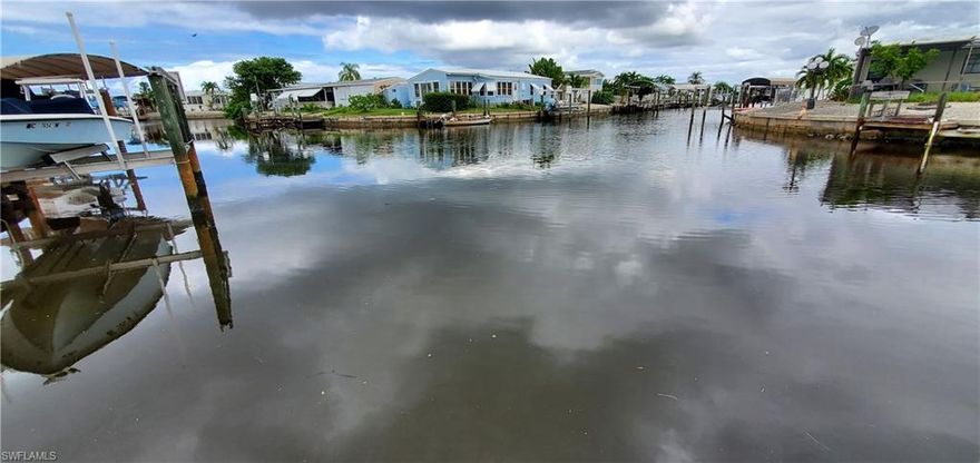 Gulf access with a covered boat lift and no bridges to the amazing Gulf of Mexico. This cute 2 bedroom home is move in ready and furnished in sought after Saint James City. Laminate flooring with a eat in kitchen and plenty of storage space. Master bedroom over looking the beautiful waters. Great outside living area for entertaining or morning coffee with enough room for your RV with a 30 AMP plug. Great for seasonal and even better for all year round. Close to all the happening spots and half dozen marinas that you can cruise to on a golf cart. Call now for a showing
