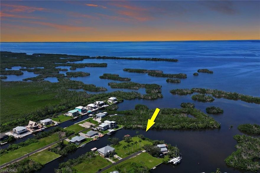 Discover a rare gem in the heart of Southwest Florida’s coveted Pirate Harbor community—a breathtaking half-acre lot that embodies coastal paradise. This oversized, tip-lot property, the only one of its kind available, boasts over 300 feet of pristine waterfront, offering unrivaled sailboat access to the open waters of the Gulf of America and beyond. Imagine casting off from your private dock, gliding effortlessly toward adventure, with the shimmering expanse of open water at your doorstep. Cleared with plenty of fill dirt on site, this stunning lot is a blank canvas ready for your dream home, where every day begins with serene water views and ends with vibrant, awe-inspiring sunsets. The natural beauty of Pirate Harbor surrounds you, with quick access to the region’s enchanting barrier islands—perfect for exploring hidden coves and pristine beaches. Whether you’re an avid boater, angler, or simply crave the tranquility of waterfront living, this lot delivers a lifestyle of unparalleled freedom and splendor. With the potential to split into two parcels, the possibilities are endless. Conveniently located just 15 minutes from Punta Gorda Airport, this slice of heaven combines seclusion with accessibility. Don’t miss this extraordinary opportunity to own a piece of Pirate Harbor’s coastal allure. Seller financing available with flexible, negotiable terms—inquire for more details.