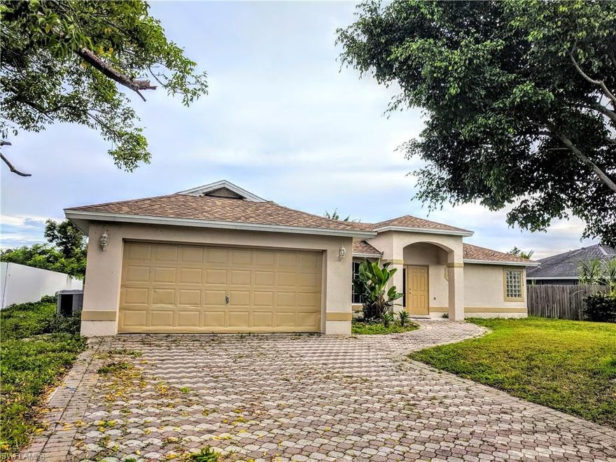 Beautiful Canal Waterfront Home at the quiet GOLDEN GATE Community. No Homeowners Association. This spacious 3BR+2BA+2-car Oversized GARAGE +Covered Lanai offers an open floor plan. Upgrades include a *2018 NEW ROOF*2019 NEW CENTRAL AIR CONDITIONER *FRESH PAINTED *CERAMIC TILE THROUGHOUT. The almost 1/4 of acre BACKYARD has enough room for building a Pool of your dreams and is Surrounded by lush plants and 80 feet WATERFRONT CANAL creating a private oasis. An additional Screened lanai overlooks the breathtaking Sunset. Upgrades include a *2018 NEW ROOF*2019 NEW CENTRAL AIR CONDITIONER *FRESH PAINTED *TERRIFIC LOCATION just minutes to GOLDEN OAK Community Park, Restaurants and Shopping and convenient short drive to Interstate 75. New kitchen cabinets!