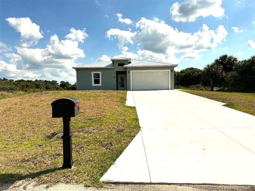 Brand NEW Home….MOVE IN READY! Seller will contribute upto $10,000 towards Buyers closing costs and prepaids. Come check out this well appointed lovely home in Banyan Village.  From the soft close cabinets to the quartz countertops….this 3 Bedroom, 2 bath, 2 car garage CBS home is well designed and a show stopper! Extra large 3x3 tiles throughout, give this home a designers touch along with the extra large walk in showers with beautiful golden finishes. Its built to last, with its metal roof, impact glass windows and concrete block construction. For an added bonus, for those that love big family gatherings, there’s a built in outdoor concrete barbecue island with stainless steel cabinets and full size sink. This home is calling your name.  Come make your appointment today and start enjoying the relaxing lifestyle of Banyan Village in Hendry Co.
