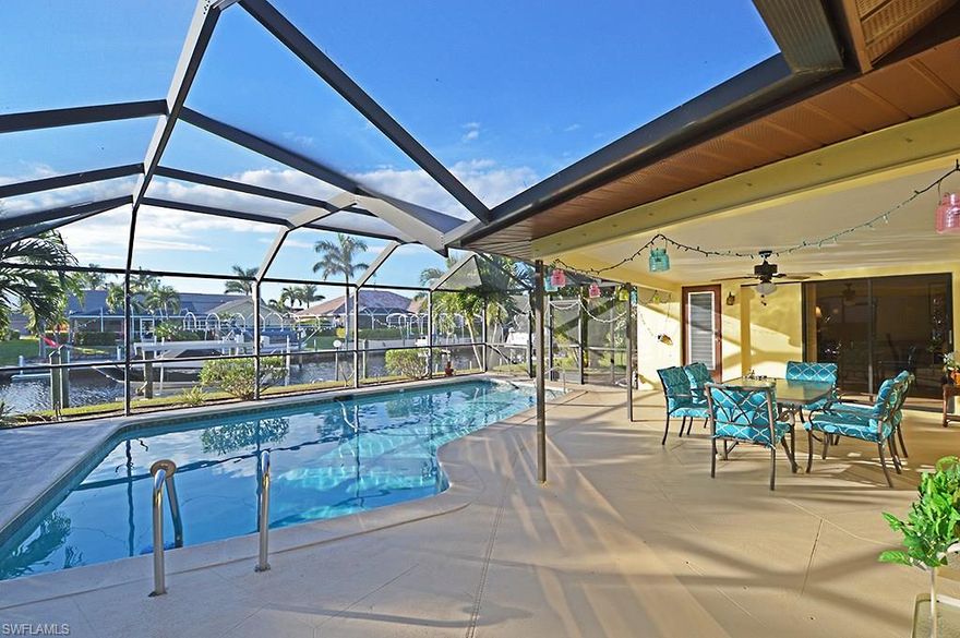 HUGE SAVINGS & HOT LOCATION! Sailboat Gulf Access Pool & Spa Home with Newer 13,500 LB Lift, NO BRIDGES OR LOCK to clear your vessel. Located on a very pretty street in SW Cape, Off Skyline, Near El Dorado, SOUTH of Cape Coral Pkwy! This home can be sold furnished, turn-key or unfurnished. Ideal as a family home or for a vacation rental. The curb appeal of this home displays a beautiful Canary Date Palm on a nice manicured street. The layout of this home offers pocketing sliders from living, master and family/den areas, a pool bath & the kitchen has a window pass thru for entertaining to the lanai. See a beautiful pool & sunsets over water views with many yachts lining the canal sending the message this is where the serious boaters live. Many improvements, from BRAND NEW ROOF in 2015, Freshly Paint, Traventine Tile, Hew Carpet, Stainless Appliances, Hunter Douglas Luminettes, Crown Molding, New Leaded Glass Front Door, Hurricane Protected with Complete Hurricane Panels & Garage Door and More! In this boaters neighborhood near Tarpon Point Marina, you will be hard pressed to find a home that comes any where near this amazing home with a boaters package all set up for this price.