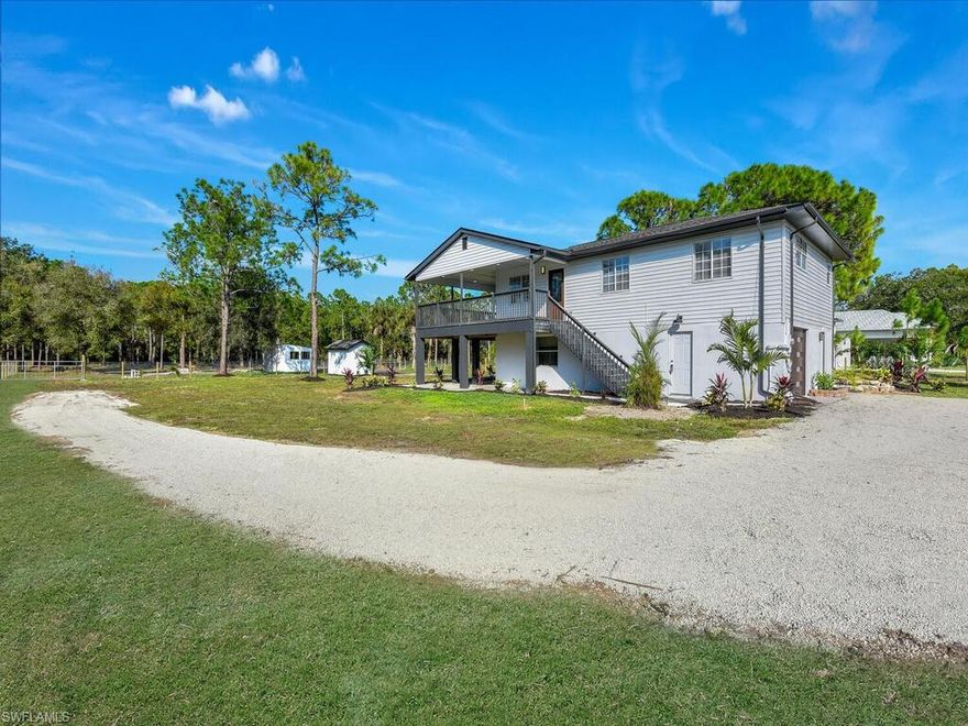 Lowest Priced Equestrian Property in Naples.  This home has been recently updated and improved and ready for your horses or other farm animals. Imagine sitting on your 2 level porch and overlook the 2.27 mostly clear acres shaded with pines and oak trees.  The property is fully fenced with new fencing, multiple gates, a gated entry, a  3 stall horse barn, and a 60 foot round pen.  Recently updated with new roof, new luxury vinyl plank flooring throughout, new appliances, updated bathrooms, new whole house reverse osmosis system, new garage door and opener, new doors and trim, new lighting and fans, and freshly painted inside and out.  The home features 3 bedrooms, 2 bathrooms, living room, dining area  kitchen and oversized covered porch on the main(2nd level) and a 2 large rooms on the lower level with separate central a/c unit.  Finishing touches are still being made to the home, but hurry don't miss your opportunity to own this Equestrian Estate at this great price.  Close to new Publix on Randall Blvd.