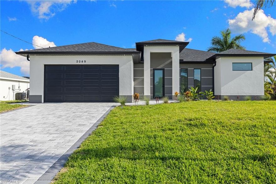 Up to $10,000 toward buyer’s closing costs with acceptable offer! Step into this stunning brand-new construction pool home located in a highly desirable area outside of a flood zone—offering both peace of mind and modern luxury. From the moment you walk in, you’ll notice the bright, open layout enhanced by soaring 9’4” ceilings, 8’ interior doors, and impact-resistant windows that flood the home with natural light. Large polished tile flooring runs throughout, giving the home a sleek, high-end feel. The chef-inspired kitchen features beautiful Calacatta-style quartz countertops, custom cabinetry that extends to the ceiling for maximum storage, and a clean, modern design perfect for entertaining. The spacious master suite is your private retreat, complete with a soaking tub and an oversized walk-in shower featuring a glass enclosure, multiple shower heads, and upscale finishes. Step outside to your own private oasis—featuring a large pool, an extra-large brick paver deck, and a full screen enclosure, perfect for enjoying Florida living year-round. The brick paver driveway adds both curb appeal and durability. Additional features include a fully equipped laundry room with built-in cabinetry and a utility sink for added convenience. Move-in ready, packed with upgrades, and located in a prime area—this home checks all the boxes. Schedule your private showing today before it’s gone!