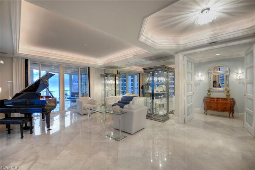 Sweeping breathtaking Gulf, bay and city views make this Park Shore 901 condo in the Aria a desired residence. Spread over a convenient 4,096 square foot floor plan, there are 3 bedrooms plus a den and 3.5 bathrooms, making this an ideal residence for luxury living. Upgrades are new and numerous, and include many of today's most sought-after features: marble flooring in the main living areas, a large modern chef's kitchen with upgraded appliances, granite countertops, center island, a 5 burner gas cooktop, a master suite with granite countertops in the bathroom and custom fixtures and large shower area; a den with wood flooring and a limestone fireplace that doubles into the family room; custom wall accents and ceiling lighting details; all main living areas and bedrooms have access to three private terraces for gulf watching and sunset views; electric hurricane shutters, storage unit; and much more. Aria includes lobby security, on-site manager, guest suites, fitness center, two social rooms, and a private oversized pool with a large deck and spa, boat slips available for lease or purchase, and more!