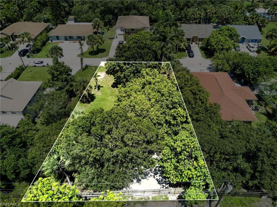 EXCEPTIONAL LOCATION & DEVELOPMENT POTENTIAL IN NAPLES! Take advantage of this rare opportunity to build in the high-demand Bayshore/Gateway Triangle area. This cleared, 100% upland lot is zoned RMF-6 / BZO-R1, allowing for a duplex or single-family residence—perfect for rental income, multigenerational living, or resale. Utilities already on-site with an installed water meter and electric available. Lush landscaping includes mature palms and a mango tree for a tropical touch. Just minutes from Naples' iconic 5th Avenue, world-class beaches, Tin City, shopping, dining, and the trendy Seed to Table market. Located among upscale new construction and modern homes, this lot offers excellent value in one of the area's fastest-growing corridors. With strong rental potential, this is the ideal spot for your next investment or custom build. THIS PROPERTY QUALIFIES FOR A 1% LENDER INCENTIVE IF USING PREFERRED LENDER, INQUIRE FOR MORE DETAILS**