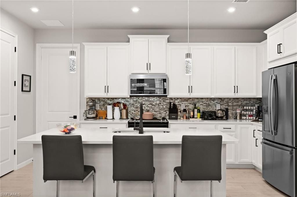 Photo of 10353 Bonavie Cove DR, FORT MYERS, FL 33966 (MLS # 226016818)