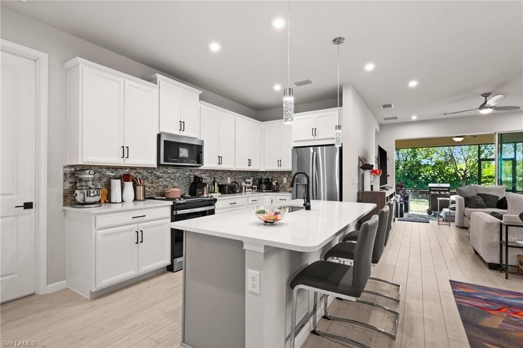Photo of 10353 Bonavie Cove DR, FORT MYERS, FL 33966 (MLS # 226016818)