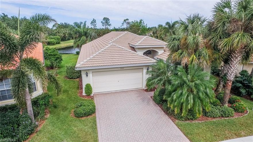 Must see beautiful two bedroom plus den "Egret" model is located on a very private lot in the prestigious community of Saturnia Lakes in Naples. Spacious great room with plenty of sunlight featuring diagonal tile, vaulted ceilings and scenic view of the lake and wooded area. Huge kitchen adjoins the living area with ample high quality cabinetry, newer stainless appliance suite, casual breakfast area and formal dining room. Equipped with central vacuum system, elec/man hurricane shutters and community fees include cable, internet, irrigation, lawn care and exterior pest control. The master suite has tray ceiling, walk-in closets, luxury bath with dual vanities, make-up vanity, soaking tub and glassed shower. Beautiful ell shaped extended screened lanai is perfect for entertaining and taking in the scenic lake views and adjoining public golf course. Saturnia Lakes offers resort style amenities including heated swimming pool, lap pool, spa, fitness room, dance studio, saunas, billiard room, grande ball room, 4 clay tennis courts, playground, basketball court, putting green and miles of walking paths. Perfect location and ready for you to call home.  Schedule your private tour today.