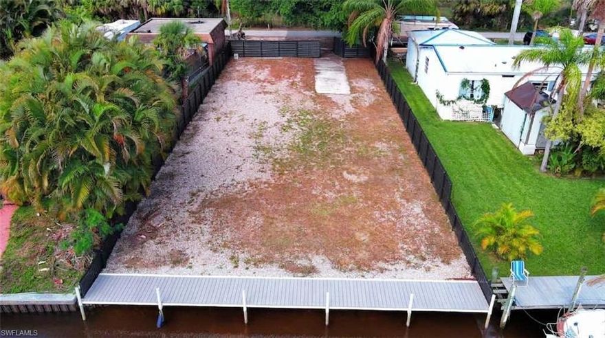 Own this Waterfront Lot with Direct Gulf Access -BRAND NEW SEAWALL (2025) and NEW CONCRETE DOCK (2025)!
Build your custom Florida sanctuary at 2228 Marina Park Drive. This prime lot in the non-gated Fort Myers Shores community is a boater’s dream, featuring deep water, direct Gulf access with NO bridges. The property is ready for your vision, complete with a brand-new seawall (2025), new 50x5-foot solar-lit dock (2025), and new fencing (2025).  Water, sewer, and electric are available at the street.   
Your boating lifestyle is made easy with Calusa Jacks Marina located at the end of your canal, providing convenient access to diesel and ethanol-free fuel, plus an on-site marine mechanic for all your maintenance needs.
Nature lovers will appreciate the quiet beauty of the 10-acre county-owned waterfront preserve being developed directly across the street. Enjoy the peace of mind that comes with a protected natural view, and boat from your backyard to the Intracoastal waterway to the East Coast, beautiful white sand beaches of Sanibel, Captiva and Fort Myers Beach.
With NO HOA fees and NO deed restrictions, this ready-to-build custom home lot offers the ultimate freedom to create a forever home or a high-value investment. Seize this rare opportunity to own this upgraded slice of heaven.  Close to all the activities and fun things to do at Babcock Ranch and Downtown Fort Myers and close to RSW International Airport.