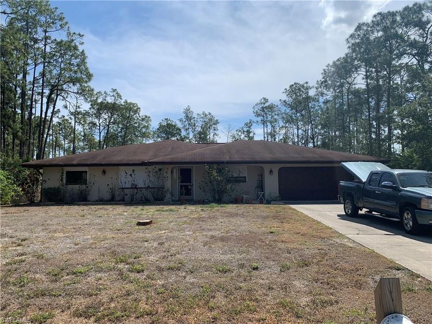 Full 1 ACRE corner lot!  Large fenced backyard with nice storage shed.  There is plenty of room in this open floor plan with large bedrooms and the open great room.  Laundry room is big enough to use as a third bedroom!  Air conditioner system is just a few years old and in great shape.  Pocket sliders lead out to the large 12x44 screened lanai overlooking the backyard.  All window openings have roll down storm shutters and the sliding glass doors also have accordion shutters for storm protection.  Located between Joel Blvd and Richmond avenue provides convenient access to anywhere you will want to go.  If you are looking for your new home with plenty of land this is your chance!