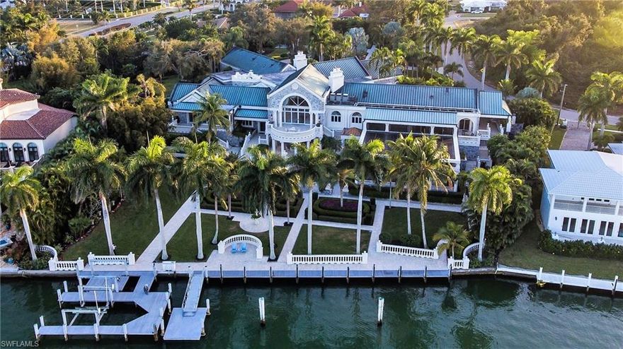 NO RESERVE AUCTION ON FEBRUARY 9TH, 2019. IMPRESSIVE RENOVATED WATERFRONT ESTATE sits on 4 Lots with spectacular open views on a protected cove, Robert's Bay, with beautifully landscaped gardens throughout.  Built like a fortress, the home sits on the highest waterfront elevation on the Island.  Offering outstanding Architecture, Stone exterior, Copper Roof, Porte Cochere Entry, Circular Driveway, and impressive appointments. Home has undergone two major renovations & additions.  Exceptional Value.  The entire property is fenced and gated offering maxim privacy.  Private Pool w/Spa, Screened Patio, Veggie Garden and Tennis Court.  Plenty of land and parking areas.  Sold Turnkey, as shown when you visit the property.  (See Realist for Lot dimensions- Irregular shape) - Check Open House schedule.