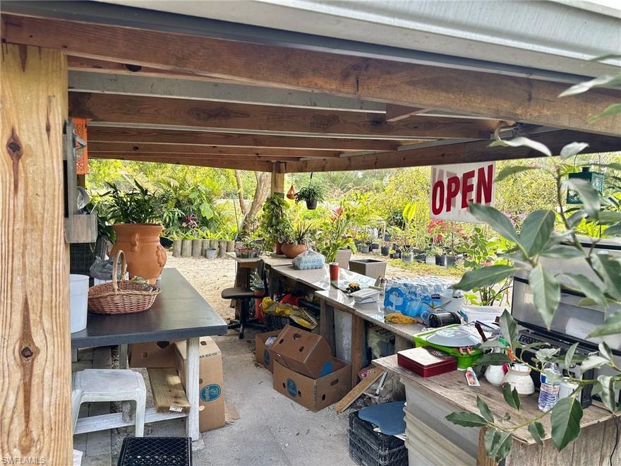 Rare turnkey opportunity: An established Buckingham Gardens and Nursery business on a large residential approximately 1.178834 acre corner lot on Buckingham Road, Westwood Acres. This property blends a licensed nursery operation with convenient residential amenities, all in one parcel. Features a wood-frame-built Tiny Home. Features are a fenced nursery operation with a cattle-gated entrance for owner and visitor parking/loading, plus a large, roofed sales stand and expansive inventory of potted ornamentals, shrubs, palms, flowering trees, ceramics, and related garden decor. NOTE: available are nine fruit filled Mango trees and two with fruit-filled Avocado trees. Included on the grounds is a wood frame equipped “tiny house” (mock kitchen, shower, toilet, bedding) with sheltered outdoor dining, surrounded by wooded screened trellis canopies, seedling beds, and potting starter work area benches. The fenced/gated private back area offers coops and space for seedling starters or hydroponics. A resident cat adds character to the property. This is a turnkey opportunity for buyers seeking an established nursery with flexible expansion opportunities and room to expand into hydroponics, propagation, landscaping services, plant rentals, or classes/workshops, etc. Items that do not convey are "marked."