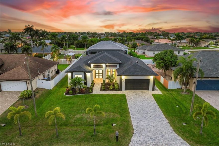 The seller purchased this exceptional property while completing their waterfront dream home and is now offering it for sale now that construction is complete. The home has been professionally inspected, and all minor items identified were addressed. The inspection report will be provided for buyer peace of mind.

This striking, nearly new custom contemporary residence blends modern design, comfort, and an enviable location in one of the area’s most sought-after settings. Built in 2023, the home enjoys desirable west-facing exposure, delivering breathtaking sunset views and a private, resort-style outdoor living experience. The backyard is perfectly designed for both relaxation and entertaining, featuring a sparkling pool, outdoor kitchen, and generous spaces for lounging and gathering.

An impressive double-door entry welcomes you into a thoughtfully designed interior where quality craftsmanship and attention to detail are evident throughout. The home showcases elegant tile flooring, soaring ceilings, and refined custom carpentry. The open great room is filled with natural light and framed by a full wall of sliding glass doors that seamlessly connect indoor and outdoor living. A dramatic feature wall with fireplace, mounted television, and custom tile detailing serves as a stunning focal point.

The living, dining, and kitchen areas flow effortlessly, creating a spacious and functional layout ideal for entertaining or everyday living. The chef’s kitchen is a true showpiece, featuring upgraded quartz waterfall countertops, an oversized island, premium stainless steel appliances, custom cabinetry, a walk-in pantry, and carefully curated lighting.

The privately situated primary suite offers direct access to the outdoor living area, spacious walk-in closets, and a spa-inspired bathroom designed for relaxation. Two additional bedrooms are located on the opposite side of the home and share a stylish bathroom with convenient pool access. A dedicated office with double doors, just off the great room, provides an ideal space for working from home or a quiet retreat.

The exterior is equally impressive, highlighted by a pavered walkway, covered front entry, Bahama-style shutters, and a welcoming front porch that enhances curb appeal. The backyard continues the resort-style ambiance with a fully equipped outdoor kitchen island complete with built-in grill, sink, beverage station, and ample space to unwind, entertain, or enjoy poolside living.

This home offers a refined lifestyle with a modern edge- thoughtfully designed for comfort, entertaining, and enjoying the very best of its prime location.