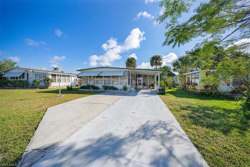 H8748 - Are you looking for a serene and welcoming 55+ community to call home? Look no further! This community is just a short drive away from beautiful downtown Naples, where you can enjoy shopping, dining, and beach activities. Inside, you'll be greeted by a spacious enclosed front lanai that boasts stunning lake views. Imagine sipping your morning coffee or enjoying a good book while taking in the tranquil scenery. The main living area, bedrooms, kitchen, and Florida room have all been upgraded with new vinyl plank flooring. You'll not have to worry about your comfort as the HVAC system was replaced in July 2018 and the hot water heater within the past few months. The utility/laundry area is located under the carport, and there's a separate workshop area for all your DIY projects. This home is perfect for anyone looking for a Naples getaway, whether it's for seasonal living or year-round residence. The home is in nice condition, but if you're feeling inspired, it's ready for your personal touch and vision. Come see this stunning home for yourself and get ready to start living the Naples lifestyle you've always dreamed of! Hurry, these don't stay on the market long at this price.