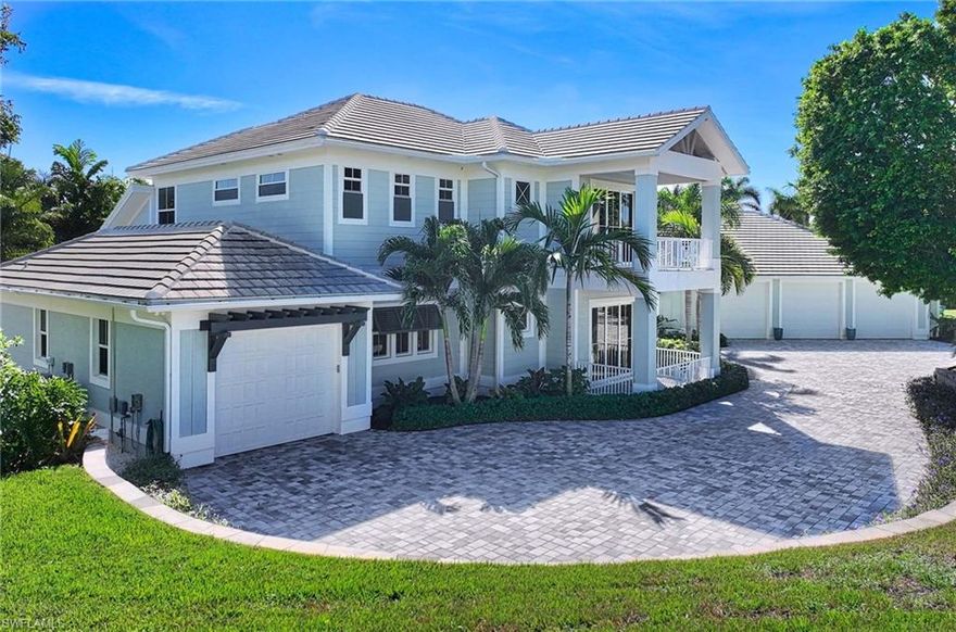 HIGH AND DRY AT 22.9’ ELEVATION! This one-of-a-kind CUSTOM BUILT Coastal Design home is situated on .6 acres of much sought after Southern exposure in the highly desirable Estates Section of Marco Island. Features of this open concept home are 4 bedroom ensuites,  powder bath, elevator, whole house gas generator,  private resort style beach entry pool with rock waterfall, spa and 100’ lazy river, lush landscaping, 2 Carrier Infinity High Efficiency A/C units, 2 Mini Split A/C units, fire pit area, climate controlled garage with car lift for 7+ cars, and attached 1 car garage.  Some of the interior highlights are wood and beams at ceiling , Shiplap accent walls, 2 piece crown molding, 8’ tall shaker style interior doors , 9” wide White Oak Engineered wood plank flooring, wood shelving in closets, porcelain tile in bathrooms and foyer, recessed LED lighting, Fanimation high end ceiling fans, and designer light fixtures. The main ensuite offers 2 closets, one of which is a large walk-in. The main ensuite spa-like bath offers dual wood vanities with Quartz countertops, Freestanding soaking tub with floor tub filler, large recessed walk-in shower with mulitple shower heads. The Main Floor ensuite bath offers double bowl vanity, Quartz countertops, and a large roll in shower. The large Laundry room offers lots of cabinets, office area, sink, and hanging bar for clothes. The Chef’s kitchen is U- Shaped with a 10’ long island and granite countertops. The stainless steel appliances are high end Wolf/Sub Zero brand. The ceiling height cabinets are solid wood construction with Shaker and Louvre style doors which conceal a hidden walk-in pantry.  The dining area consists of a dry bar with matching cabinets and counter tops as the kitchen. The sliding glass doors in the Dining Room and Great Room pocket behind a wall for a seamless view of the tropical oasis and the continuation of living area.  The expansive screened in lanai is great for entertainment. The lanai has an outdoor kitchen with cabinets, granite countertops, sink and built in grill with wood hood. Other features of the Lanai include painted wood ceilings, wet location Fanimation high end fans, recessed LED lights, dining area, sitting area, TV area with seating and cabinets. For the car enthusiast, the high and dry 2328 Sq Ft climate-controlled garage can hold up to 7+ cars. The features of this garage are Epoxy floors, Vinyl Plank Flooring, Car lift, Laundry, Kitchenette, TV area, Guest Bedroom with Bathroom which also serves as a pool bath. Finally, relax in the resort style saltwater pool while listening to the rock waterfall and floating around the lazy river. The lazy river encompasses a rock island with spa and bridge.  For evening ambience enjoy the color changing LED lights in the pool along with the 4-gas lit Tiki Torches and the uplights on many of the trees. Make this your slice of Paradise today!  Be sure to view the virtual tours!