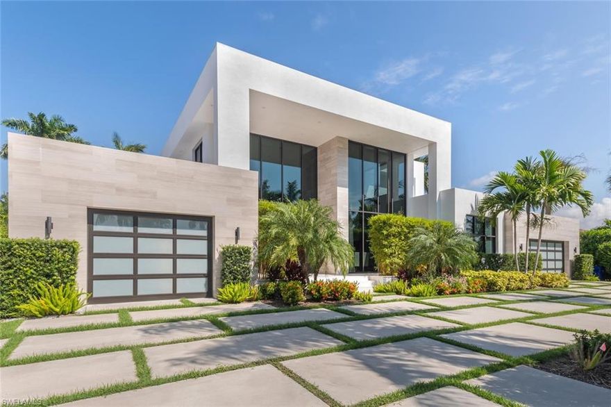 665 Fountainhead Way is a tropical oasis tucked away in the prestigious Park Shore neighborhood. Newly built contemporary masterpiece that blends clean lines and timeless styling, creating a distinctive one of a kind home. An open floor plan features walls of glass, the home features exceptional high end finishes. Chef’s kitchen featuring large island, custom German ALNO cabinets, solid surface counters, Thermador appliances of dual ovens, induction cook top, coffee/espresso system, dual dishwashers. Ground floor master suite features are highlighted by custom California closets, an elegant edge less shower and free standing soaking tub. Three en-suite guest bedrooms each feature custom California closets & outdoor terraces. Climate controlled 3 car garages and full house generator. The backyard is a tropical sanctuary with an infinity edge spa, large sun deck & sun shelf surrounded by lush tropical landscaping. Park Shore is centrally located just 4 miles to downtown Naples 5th Ave & 3rd St, or 4.5 miles to Mercato. Residents of Park Shore enjoy optional membership to the private beach park plus the option to purchase a boat slip at Venetian Bay Yacht Club!