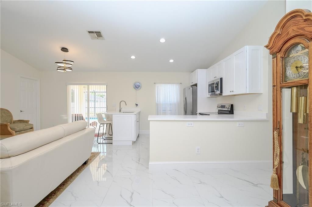 Photo of 2519 6th ST W, LEHIGH ACRES, FL 33971 (MLS # 226017831)
