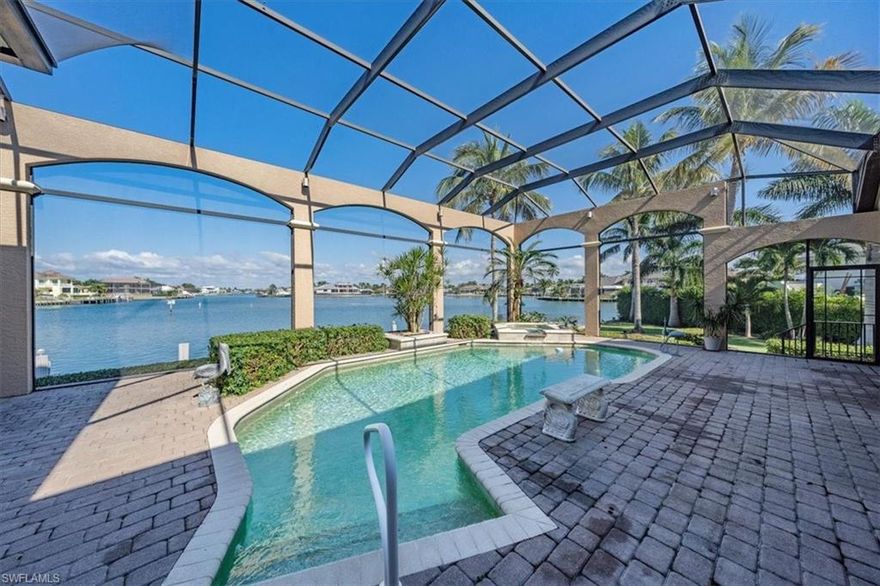 H4156 One of most premier locations on Marco Island at the tip of prestigious Caxambas Island with 298’ on the water.  Absolutely amazing bay views from every room in this beautiful Divco custom built residence. Waterfront living at its finest with over 250’ of dockage including space for 2 boats on lifts, floating kayak dock, expansive waterside deck and plenty of room for a large yacht. Spacious outdoor living to sit back, relax and enjoy the famous Marco Island sunsets.  Screened lanai offers outdoor kitchen, pool and spa with custom lighting. The interior features a large picture window in the living room and 90 degree pocket sliders in the family room to maximize your view and custom ceiling details with coffered ceilings in living room and den. Master suite features a sitting area with view to the bay. This spacious home offers 6 bedrooms 4.5 bathrooms plus den, 3 car garage and an abundance of storage. Kitchen has been recently updated offering quartz counters, white cabinetry and an exquisite backsplash as well as an adjacent formal dining room. Oversized lot offers privacy from the neighbors and a large side yard on each side of the home. Don’t miss out on this rare opportunity!
