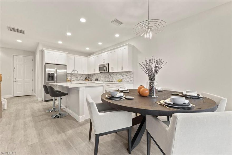 Feels like new construction. The value is in this Pulte Davenport floor plan that is the perfect family home. The beautifully updated kitchen is modern, light and bright with 42' soft-close cabinetry, stunning quartz countertops, natural stacked stone backsplash, 5 1/4" baseboards and a large center island. Luxury vinyl plank flooring throughout the first-floor living area, common area upstairs and master suite. The double staircase with newer carpet opens to the kitchen and living room. Upstairs are 3 spacious guest bedrooms with newer carpet. The large master suite has an oversized walk-in closet. A spacious master bath with dual sinks and separate soaking tub and shower. The expansive screened lanai has access to the powder room and opens to a manicured backyard. An abundance of storage space. This gated community has wonderful amenities including 2 heated resort-style pools, zero entry kid-friendly splash zone, cabanas, new clubhouse with a catering kitchen, fitness center with child play area, bocce ball, tennis, sand volleyball, basketball and playground. Low HOA fees. Approximately 2 miles to top-rated elementary, middle and high school. Close to shopping and dining.