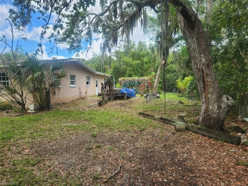 Photo of 1074 Old Bridge RD, NORTH FORT MYERS, FL 33917 (MLS # 226017636)