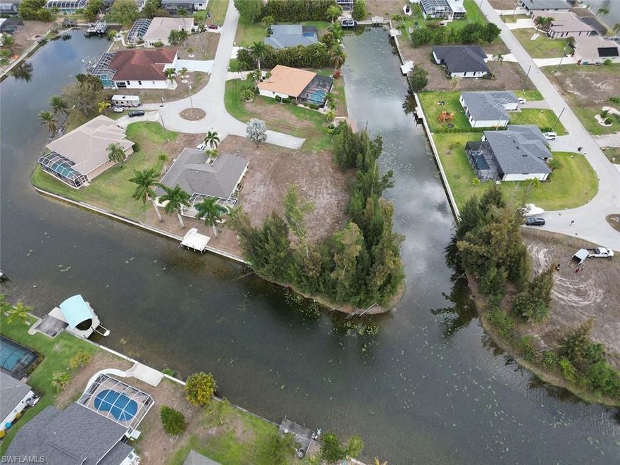 Stunning oversized quarter acre waterfront lot.  City water and sewer. No Assessments paid, Build your dream home in desirable area of SE Cape Coral 129 feet of canal frontage.  End of cul-de-sac 8 minutes to Cape Coral High School, Near Pine Island corridor shopping and Restaurants.