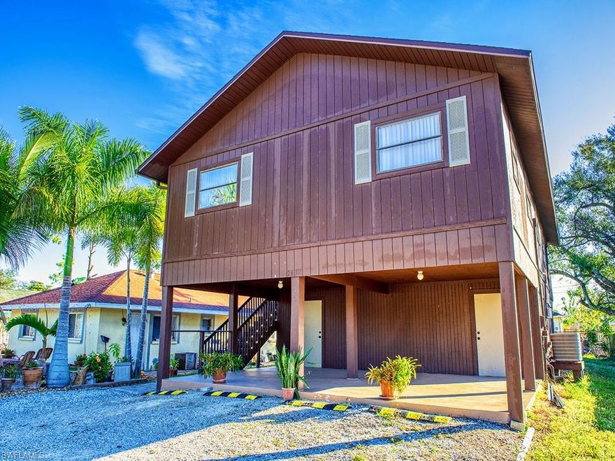 Can be used as an In-Law suite or for extended family home. An Investor's Dream! Lucrative income possible. BACK ON THE MARKET-THEIR LOSS YOUR GAIN! One meter for electric and plumbing. Two story, well kept, X flood zone duplex in booming Bonita Springs. The upper unit has three bedrooms with new carpet, 2 baths and a large bright great room with high ceilings, The spacious kitchen has wood cabinets and ample counter space. The dining room adjoins a wide porch. Fresh paint inside and out.  There's plenty of room for a large family and entertaining. Lower unit has one bedroom and one bath. Screened-in house width porch overlooks the back yard. Both units have private storage units and an extra large parking area. This duplex had a new roof installed 2018. Close to all shopping, schools and beaches. This is the best, come and see!!