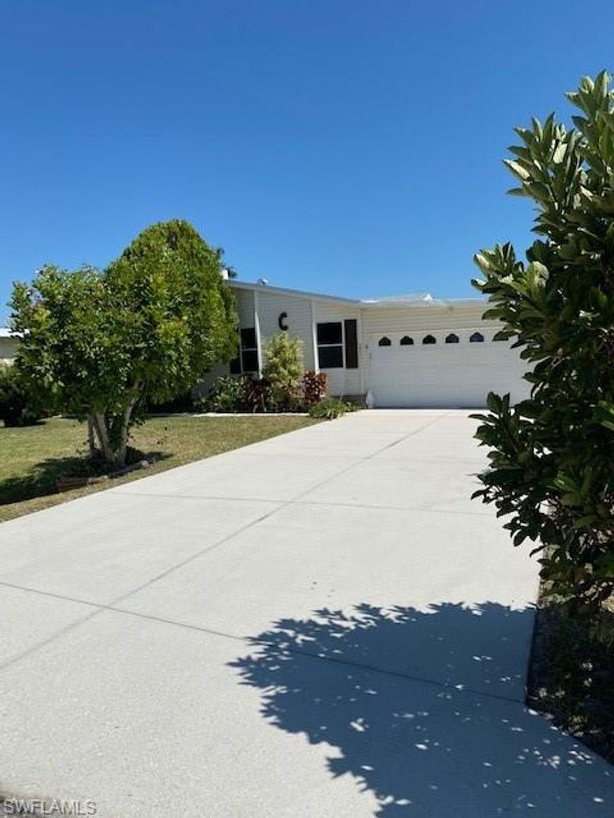 Live between Naples and Marco Island on the water. Riverwood is a 55+ community attached to Rookery Bay Estuary offering boating, kayaking, canoeing and world class fishing right out your backdoor. Riverwood residents have access to private community fishing dock and boat ramp. It's a 20 minute nature filled boat ride to the Gulf of Mexico. Convenient to everything in growing East Naples. This huge 1847 sq. ft. under air Palm Harbor Home built in 1996 has welcoming open floor plan with 3 bedrooms, den with wood burning fireplace, 2 full bath with walk-in tub, huge sunroom on lake and garage 3016 total sq. ft. City water and sewer, sprinklers.  0.16 acre lot that you own. Assoc. fee $190. yearly. Very well maintained, updated roof and AC.