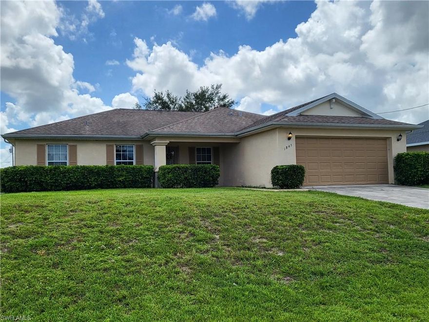Must see this roomy 1666 sf home with 3 bedrooms, a separate den (or extra bedroom), 2 baths and a 2 car garage. It has a huge great room with vaulted ceiling. The living, dining and kitchen are all connected! The living room has a triple slider that opens to the large screened lanai and BIG backyard with a nice shade tree. The split floorplan allows privacy for the main bedroom which includes an en-suite bathroom with double sinks and 3 closets. The guest rooms are roomy and there is even a built in desk great for homework or crafts. There is a large indoor laundry room as well. With a little TLC this home would be perfect for any size family! This home is a bargain at this price, so dont miss it!