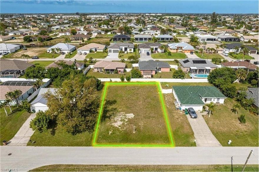 Wow! Here's your chance to own a piece of paradise in one of the most desirable locations in Cape Coral! This expansive vacant lot is situated in the prestigious Southwest Cape Coral area, epitomizing the pinnacle of coastal lifestyle. This beautiful lot is cleared and ready for you to build your dream home! Surrounded by prime real estate, 400 miles of waterways, and Gulf access properties, it's just minutes from Cape Coral Parkway's vibrant nightlife, superior shopping, sought-after dining, and the city's weekly farmer's markets—every convenience is at your fingertips! Enjoy seamless access to Fort Myers, Cape Harbour, Tarpon Point, the Yacht Club, and Cape Coral Beach, offering endless opportunities for leisure and adventure, all within a mere 10-minute drive. Top-rated high schools, middle schools, and elementary schools are within 1.5 miles. Visit the new Joe Coviello Park, 1.5 miles mile away, featuring 50 acres with a walking path, picnic tables, boardwalk, pier, and opportunities to encounter eagles, gopher tortoises, and other native animals. It gets even better—this lot is on city water and sewer, and the assessments are nearly paid in full! Truly experience all that SW Florida has to offer! Don't miss this extraordinary chance to secure your slice of paradise in one of Cape Coral's most coveted locales.