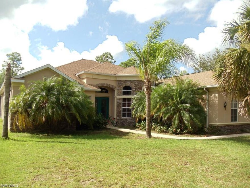 Beautiful 4 bedroom, 3 bath on 5 secluded acres in Golden Gate Estates. Carpet and tile, detailed ceilings, family room, den, great room and formal dining room. Breakfast bar in kitchen, caged pool w/spa, dual zoned AC, attached 2 car garage and sprinkler system.