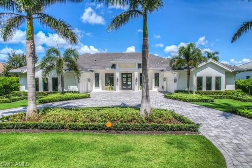 IMMEDIATE GOLF MEMBERSHIP AVAILABLE — a rare opportunity to secure a fully customized luxury residence with immediate access to championship golf and club amenities in one of Naples’ most prestigious communities.

This exceptional 6-bedroom, 6.5-bath estate offers a refined, move-in-ready lifestyle overlooking a tranquil lake and the picturesque Lakes Course Hole 12 (Par 3). Thoughtfully designed and meticulously upgraded with over $1 million in high-end enhancements, the home delivers the scale, quality, and craftsmanship often sought by buyers relocating or establishing a second residence in Southwest Florida.

Unlike typical resale properties, this residence was custom built on a separately purchased homesite, allowing for a truly tailored living experience. Soaring 16-foot ceilings in the main living areas, 14-foot ceilings in the bedrooms, and custom 12-foot doors throughout create an immediate sense of volume and sophistication. Wide-plank Legno Bastone La Famiglia hardwood flooring—knot-free and richly finished—adds warmth and modern elegance, while designer furnishings by Clive Daniel elevate each space with curated style.

The chef’s kitchen is both beautiful and functional, featuring Sub-Zero appliances, dual dishwashers, marble countertops protected by TuffSkin, and custom cabinetry by Design Works—ideal for entertaining family and guests with ease. Each bath is designed as a private retreat, finished with Ruben Sorhegui marble tile and Newport Brass fixtures. Two Stellar Galaxy Series fireplaces with no-heat glass add ambiance without compromising comfort.

Outdoor living is equally impressive. The west-facing lanai captures breathtaking sunset views over the lake and features a 20’ x 40’ saltwater Pebble Tec pool with sun shelf, full outdoor kitchen with quartz countertops, and generous space for year-round entertaining—perfect for both seasonal and full-time enjoyment.

Additional features include hurricane impact windows, a whole-house generator, advanced security system, and smart-home technology, providing peace of mind whether in residence or away.

This is a rare offering for buyers seeking immediate enjoyment, uncompromising quality, and a refined Florida lifestyle with no wait!