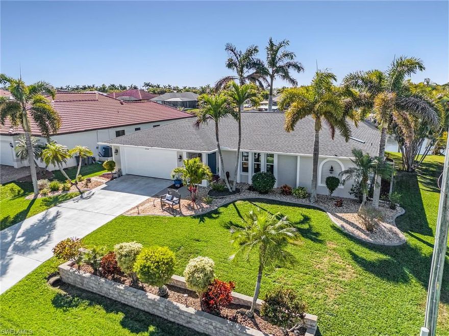 LOOK NO FURTHER! Beautiful waterfront living in the heart of one of Cape Coral’s highly desirable neighborhoods. This Gulf-access home embodies refined coastal living at its finest with high elevation and no flooding. Updated, 3-bedroom, 3 full bathroom, home office / den, boasts southern exposure and has the perfect outdoor living space. Abundant covered and uncovered lounging areas and tropical landscaping complemented by a 185 ft wide canal, composite dock with captain’s walk, 13,000 lb. boat lift with shore power, private pool and a beautiful yard, to act as the backdrop to your new Florida lifestyle.  This owner’s personal home, never rented, is an immaculate residence offering the rare opportunity to move in, jump in and boat away. Split-bedroom floor plan provides both privacy, functionality, and flow—ideal for hosting family and friends. As soon as you enter the home you are greeted by its soaring water views from almost every angle, with its open concept. The whole house has new hurricane impact windows, doors and sliders, a new roof in 2022, new lanai screens 2022, new a/c 2018 and custom detail throughout, the list goes on. This is a must-see home! Every corner invites relaxation under warm Florida breezes. Take a boat ride from your house to many of the waterfront dining locations or beaches. Minutes to Cape Harbour and downtown Cape Coral. Very desirable schools are located close by. Don't miss your opportunity to make this house your home, whether it’s for personal use or an investment in your future.