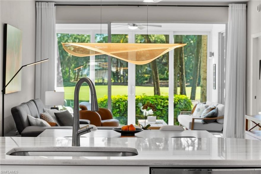 Most Stonebridge properties embrace traditional Florida coastal. 1960 Willow Bend Circle #102 took a different path—floor-to-ceiling glass framing the 10th green, contemporary finishes, and a mid-century modern aesthetic that prioritizes clean lines over ornate details.
Morning light floods 1,568 square feet of first-floor living through eastern-facing windows where the 10th green becomes your backyard. The design language is deliberate: light wood-look LVP flowing throughout, white subway tile backsplash, minimalist hardware, and a neutral palette that lets the golf course views take center stage. This isn't builder-grade Stonebridge—it's thoughtfully curated modern design. The kitchen's quartzite counters and stainless appliances handle daily life with understated efficiency.
The primary bedroom opens directly to the screened lanai where golf views and morning coffee become ritual. Roll-down screens extend usability year-round, whether you're watching golfers navigate the 10th or simply claiming the quiet before the day begins. The second bedroom provides guest flexibility or workspace that actually has separation.
AC replaced July 2025 means immediate peace of mind. First-floor positioning means no elevator waits, immediate lanai access from the living room and primary suite. The kind of layout where indoor and outdoor living blur naturally.
Bundled Stonebridge golf membership, Kipp Schulties' redesigned championship course, Bistro dining, resort-style pool—all included. But the real value is the aesthetic: a contemporary design approach in a community known for traditional finishes.
This represents the increasingly rare intersection of modern design, golf course living, and first-floor convenience in Stonebridge. For buyers who've been waiting for Stonebridge to feel contemporary rather than traditional, this is it.