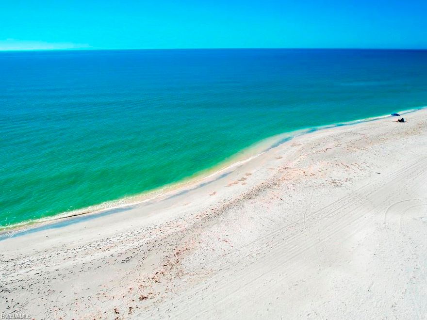 Cool, calm, and coastal, this beautiful island-inspired home is ideally situated in the prestigious Gulf Ridge beach community. Enjoy sun-filled days at the beach and unwind in the evenings by your private tropical pool oasis. Offering over 3,000 square feet of living space, the home features a thoughtfully designed split-bedroom floor plan with expansive living and dining areas overlooking the elevated, screened pool.

The great room is the heart of the home, highlighted by a striking coral stone fireplace, wet bar, and an open entertainer’s kitchen. A casual dining area invites family and friends to gather with ease.

Surrounding the pool, the covered lanai creates an exceptional outdoor living environment designed for both entertaining and relaxation. Accessible from the great room, living room, and primary suite, this space includes pool bath access, an extensive covered area, an outdoor bar, and a pass-through kitchen—perfect for spending the day in true island style.  4 bedrooms include a delightful owner's suite with a freestanding soaking tub and luxurious shower, dual sinks and tremendous storage.  The owner has connected the 4th bedroom to create a dressing and staging area. 

The unfinished lower level offers abundant storage for bikes, beach gear, and hobbies, along with a three-car tandem garage.

Recent upgrades include a new metal roof, remodeled kitchen and primary bath, renovated guest bath, impact windows, fresh interior and exterior paint, new front doors, an elevator lift at the entry, and extensive new landscaping that creates a lush tropical garden setting.

Gulf Ridge is known for its incredible landscapes and beautifully maintained grounds.  FOUR PRIVATE beach access points including 2 that accommodate ATV's.  2 community pools, tennis courts, and a kayak launch into Old Blind Pass and Bowman's beach