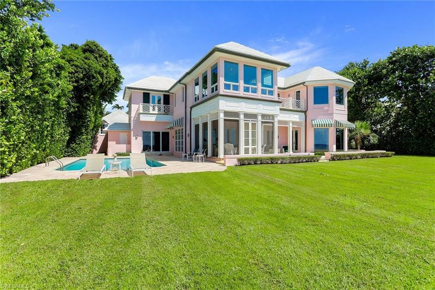 1978 Gulf Shore Boulevard, an original John Volk designed beach house with 111 feet of direct Gulf frontage and a premier Old Naples location. Surrounded by mature trees and lush tropical landscaping, this renovated property is known for its signature Palm Beach style and offers the utmost in privacy and livability. Greeted by a charming entry, the renovated residence opens to brick flooring and a streamed elegance infused by natural sunlight across bright white walls and traditional style tray ceilings highlighted by French doors that open to the exceptional beach views. The main level offers a renovated kitchen, two guest en-suites, and a beachfront traditional-style library. Maximizing the endless views is the second-floor compassing two guest suites, laundry room, and a serene master suite with a walk-in closet and bath, and a spacious sitting area to enjoy the magnificent sunset skies. Two additional guest suites, with separate living area, are perfect for extended family and guests are located on the home's north side. Outdoors, the covered lanais, clean-lined swimming pool, and tailored lawn area complete this wonderful beachfront retreat.