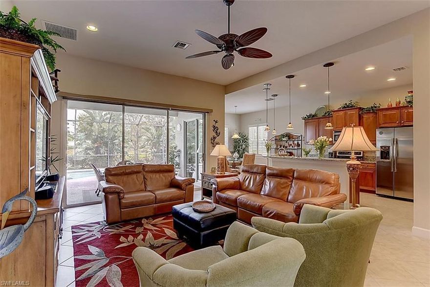 Heavenly Hawthorne! NOW VALUE PRICED FOR QUICK SALE! Stunning home with custom pool and lake view that shows like a model! Live the good life while enjoying lunch in your sparkling heated pool with built in table and underwater bench seating or relax pool side and soak up the sun on your large pool deck. Home features a unique modified popular wide open floor plan, large neutral tiles on the diagonal, plantation shutters, upgraded lighting, huge chef's kitchen with stainless steel appliances, granite counters, tumbled marble back splash and large raised breakfast bar. Also enjoy an inviting bright dining area looking out to landscaped tropical foliage and tranquil lake views. For you, take pleasure in a large upgraded master suite featuring a spacious bath with separate over-sized soaking tub and large walk in shower with frameless glass door. The home also offers two large guest suites and conveniently located and nicely upgraded second bath. Hawthorne is conveniently located in one of Bonita Springs most desirable areas close to shopping, dining and beaches. Community features resort style pool, club room, fitness center, hot tub, tennis courts and gated and guarded security.