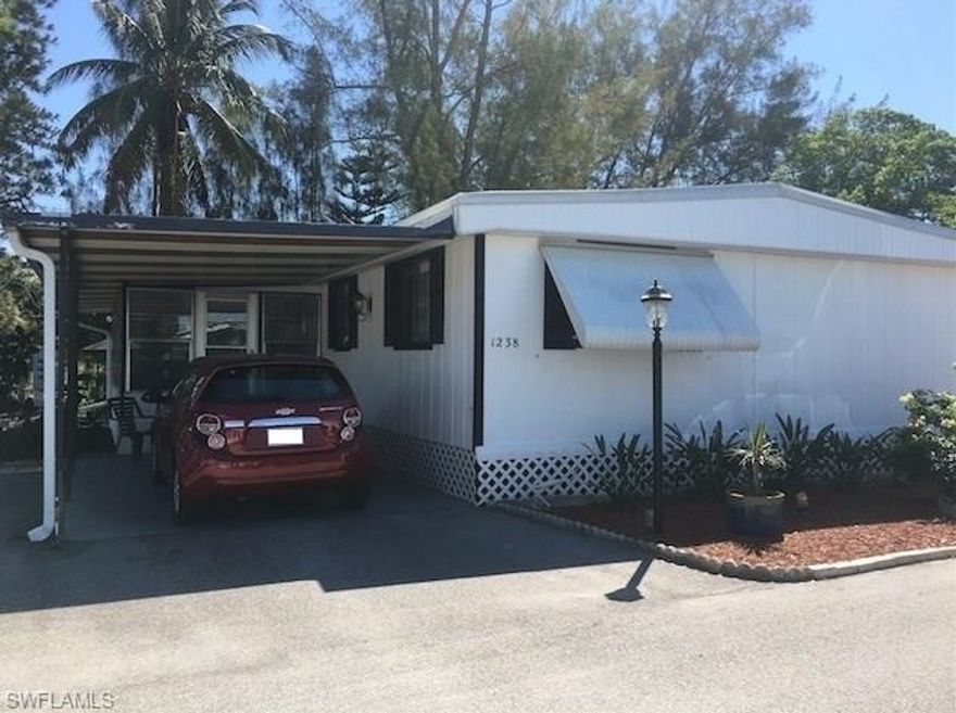 Tranquil Lake View! Recent renovations inside and out of this furnished home in a great North Naples location close to beaches, dining and shopping. Beautiful tile floors, renovated baths and kitchen, large bedrooms and inside laundry. Florida Room leads out to backyard with storage shed and sitting area with view of the lake. Extra paved parking. Park offers clubhouse, pool, shuffleboard and horseshoes. 55+ restrictions in the park. Newer AC installed 10/31/14