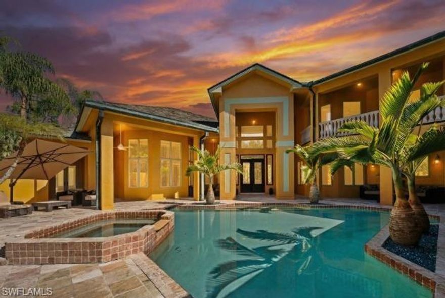 There are homes you visit, and then there are estates that quietly feel like an escape from the ordinary. Set behind lush tropical landscaping on three private acres, this Mediterranean inspired residence offers an exceptional blend of space, privacy, and the relaxed elegance that defines Southwest Florida living; surrounded by 150 palm trees and a raised garden bed. Expectations build as you peruse down the private road leading to this exceptional estate. Spanning approximately 7,600 square feet, the two-story home welcomes you with dramatic 15-foot ceilings, classic architectural details, and interiors filled with natural light. Travertine flooring runs throughout the main living areas, reflecting the sunlight that pours in through oversized windows and glass doors, creating a warm and inviting atmosphere throughout the home. The residence offers four generously sized bedrooms, four bathrooms, a private office, and an additional flex room that can easily serve as a fitness space, media room, or guest retreat. Every space has been designed to provide comfort, flexibility, and the ability to accommodate both quiet everyday living and larger gatherings with ease. The main living areas flow naturally toward the outdoor living spaces, where the home truly captures the spirit of Florida living. A separate casita flows around the pool area and feels like a private resort, surrounded by mature landscaping and open skies. It is a place for long afternoons in the sun, evening dinners outdoors, and peaceful mornings when the only sounds are rustling palms and distant breezes.

While the setting feels private and secluded, the property is located only fifteen minutes from the white sand beaches and turquoise waters of the Gulf. Residents enjoy the rare advantage of estate style living while remaining close to Naples' renowned beaches, restaurants, shopping, and cultural attractions. Additional features include a three car garage and a full house Generac generator, providing comfort and peace of mind throughout the year. For buyers arriving from colder climates or from abroad, this home represents something truly special. It offers space to breathe, sunlight throughout the year, and the lifestyle that draws so many people to Southwest Florida. intentionally positioned below market expectations for an estate of this size, acreage, and location. There are no governing HOA or deed restrictions. It represents a rare opportunity to acquire a luxurious Naples property that combines privacy, scale, and proximity to the Gulf. This is Naples living at its most refined, where space, light, and tropical surroundings come together to create a home that feels both elegant and welcoming.