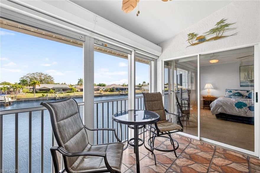 HUGE GULF-ACCESS VIEWS from this super-clean TURNKEY FURNISHED condo on the RUBICON CANAL - ALL FOR UNDER $200K!  This 2nd-floor corner condo boasts an OPEN FLOORPLAN with TALL CATHEDRAL CEILINGS and plenty of natural light from HURRICANE IMPACT windows on three sides of the unit! The large, screened lanai, overlooking the community dock, pier, and 200ft+ wide canal, is protected by rolldown shutters.  Located in a smaller and well-funded condo community, this location offers a quiet waterfront lifestyle alongside the convenience of being centrally located in the city - just minutes from groceries, gas, shopping, restaurants, and more!  Whether you're looking for a primary residence or a beautiful seasonal SW Florida escape, don't miss your opportunity to get into a really sharp, ready-to-move-into Gulf-access condo for under $200k!