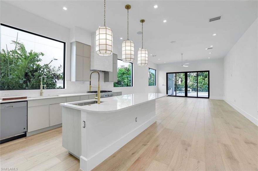 Experience the pinnacle of coastal luxury at 513 92nd Avenue North in Naples, Florida, a brand-new 2026 custom-built residence by LaGrasta Homes showcasing superior craftsmanship and an uncompromising standard of design, ideally located just two blocks from the beach in the heart of North Naples. Built with exceptional quality and storm-conscious design, this home features concrete block construction through the entire second floor, hurricane-impact resistant doors and windows, and is positioned at the highest elevation possible, built to flood elevation plus one. Air conditioning units are elevated to approximately 16 feet above flood and pool equipment 13 feet above flood, an incredible and highly valuable feature for added storm protection and peace of mind. Inside, 3,791 square feet of living space showcases a refined, open-concept layout with seamless indoor-outdoor flow. Wide plank wood flooring runs throughout the primary living areas, complementing the home’s clean architectural lines and natural light-filled spaces. The chef’s kitchen is both elegant and functional, featuring Thermador appliances and a layout designed for customization, ideal for both everyday living and entertaining. Offered as a designer-ready opportunity, there is still time for your personal designer to bring your vision to life and select the finishing touches, creating a truly customized luxury residence tailored to your style. The home offers four bedrooms and four and a half bathrooms, with the primary suite thoughtfully positioned on the second floor as a true retreat, featuring an expansive custom closet, exceptional dual vanities, a soaking tub, and a massive walk-in shower. A first-floor guest suite provides flexibility for multigenerational living or extended stays, offering comfort and privacy for family and visitors. The second-floor loft with kitchenette creates the perfect space for guests, a media lounge, or executive office.
Outdoor living is designed to impress, with a covered lanai featuring a fully equipped summer kitchen and grilling station supported by a 1,000-gallon propane gas tank. The backyard is a private retreat with a 14x28 custom pool, integrated sun shelf, and six-foot spa. The property is professionally landscaped with privacy in mind, creating a serene and secluded setting for relaxation and entertaining. Enjoy one of the most walkable coastal locations in North Naples, where you are just a short stroll to the beach for morning walks, sunset views, and everyday access to the Gulf. Close proximity to premier shopping, dining, and entertainment enhances the ease of living in this exceptional location. This is coastal luxury designed for both elegance and everyday livability.