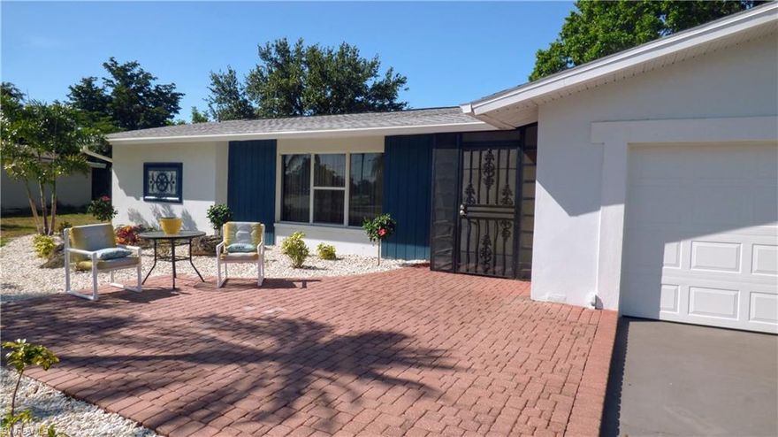 Brand New hurricane proof garage door. New Water heater in 2018. Brand New electrical panel. Brand New Kitchen counter tops with Slow Closing White Wood drawers and cabinets. Brand New roof/facia/eavestrough and front landscaping. Paver sitting areas in the Front and Back of the home. Cozy 3 Bedrooms, 2 Bathrooms, 2 Car garage. HUGE Bonus room in the back area of the house with wood floors and New window coverings with New Biltek Blinds. Property overlooks the Former Cape Coral Country Club Golf Course.  Electricity rewired. Tile and wood flooring throughout the home. All bedrooms have walk-in-closets. Lot size over 12,000 sq ft... Extra Storage area in back of house. The property would be a great Primary Residence, Second home, Vacation home, or Investment. Close to the Cape Coral Yacht Club, Tarpon Point, and Cape Harbour. Easy access for Boating, Biking, Walking, Beaches, Golfing, Airports, Shopping, Restaurants, Parks, Boat Ramps, and Much More... City Water and Sewer Assessments Are In and Paid in Full. No HOA Dues. All information in the listing is deemed reliable but not guaranteed, it is the responsibility of the buyer or the buyer's agent to verify the information