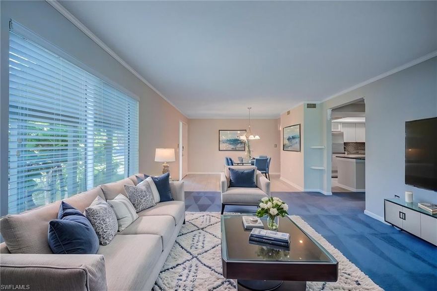 One or more photo(s) has been virtually staged, AI generated or rendered.  Discover coastal perfection in this bright and inviting 2-bedroom, 2-bathroom condo located in the highly sought-after Moorings neighborhood. Just a short stroll or quick bike ride from Moorings Private Beach Park, this residence offers convenient access to sugar-sand shores and breathtaking Gulf of America sunsets. Step inside to an open, light-filled layout perfect for relaxed Florida living. The spacious living, dining, and kitchen areas flow seamlessly, while the brand-new hurricane windows and the power hurricane shutters frame beautiful views of tropical landscaping and sunsets while providing superior storm protection. The interior has just been professionally painted and is now waiting for your unique personal touches to make it truly yours! The oversized screened lanai is the ideal spot for morning coffee or evening entertaining while soaking in the peaceful surroundings. Binnacle is a low-density, friendly community with only 28 units spread across 5 beautifully landscaped acres and a sparkling community pool. Residents enjoy the best of Naples living — private beach access, proximity to upscale shopping and dining along 5th Avenue and 3rd Street South, and quick access to everything the area has to offer. Whether you're seeking a year-round residence, seasonal retreat, or excellent rental investment, this move in ready condo delivers the authentic Naples lifestyle with low-maintenance ease. Don’t miss your opportunity to own a piece of Moorings paradise!