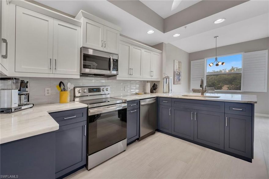 Step into refined Florida living in this beautifully updated, move-in ready first-floor end unit offering 3 bedrooms, 2 baths, and a private 2-car garage. Bathed in natural light, this elegant residence showcases a fully renovated kitchen with natural-toned granite countertops, a striking 3-dimensional tile backsplash imported from Italy, newer stainless-steel appliances, and custom cabinetry—seamlessly blending style and functionality. The spacious primary suite offers dual closets, including a walk-in with California-like built-in organization. Meticulously maintained, the home reflects true pride of ownership. Curated upgrades include fresh interior paint, designer lighting and ceiling fans, a new HVAC system, new washer, dryer, and microwave. Plantation shutters throughout, remote-controlled window treatments on the sliding glass doors, and full impact windows add both sophistication and peace of mind. Plank tile flooring flows throughout the main living areas, while warm bamboo flooring enhances the bedrooms. The screened lanai, recently rescreened, opens to serene golf course and water views, creating an ideal setting for morning coffee or evening sunsets. Set within an intimate, gated enclave of just 66 residences, this property includes bundled golf and access to an exceptional suite of resort-style amenities. Residents enjoy a championship 18-hole golf course designed by Gordon Lewis, new pickleball, tennis, and bocce courts, a 24-hour fitness center, a heated resort-style pool, spa, lap pool, scenic walking trails, and a vibrant social calendar with clubs and events for every interest. Ideally located, Cypress Woods offers convenient access to Gulf beaches, nature preserves, Mercato, and an array of premier shopping, dining, and entertainment—capturing the best of the Naples lifestyle. The new golf course and club kitchen expansion will be completed January 2027.