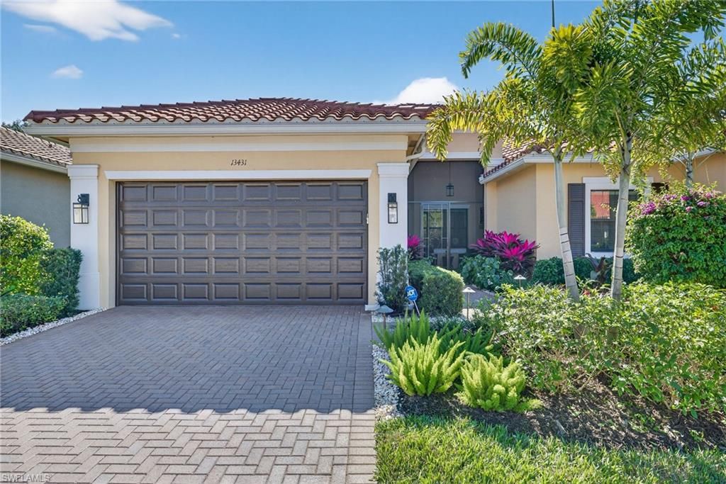 Photo of 13431 SILKTAIL DR, NAPLES, FL 34109 (MLS # 226005436)