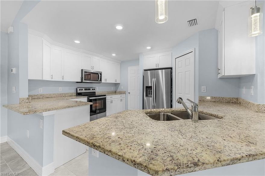 Discover the perfect blend of space, comfort, and thoughtful upgrades in this beautifully maintained 4 bedroom, 2 bathroom home offering 2031 square feet of interior living space on an oversized HALF ACRE homesite in Lehigh Acres. From the moment you arrive, the extended driveway creates a strong first impression while providing plenty of room for multiple vehicles, guests, or recreational parking, all framed by the wide open feel that comes with a larger lot. Inside, the home welcomes you with bright open living spaces finished with tile throughout, creating a clean and cohesive look that is both stylish and easy to maintain. Natural light fills the interior and highlights the spacious layout, where the living, dining, and kitchen areas connect effortlessly for everyday living and entertaining. The kitchen serves as the center of the home with generous counter space, quality cabinetry, and a layout designed for both functionality and gathering. The bedrooms are comfortably sized and thoughtfully arranged, while the bathrooms continue the same polished feel found throughout the home. This property truly stands out when you step outside into the fenced backyard, where privacy and usable outdoor space come together to create an exceptional setting for relaxing or entertaining. A custom built OUTDOOR FIREPLACE adds warmth and character, making the backyard feel like an extension of the living space and the perfect place to enjoy evenings outdoors. The included LARGE STORAGE SHED offers outstanding flexibility for tools, equipment, hobbies, or additional storage, while the oversized lot still leaves plenty of room to enjoy the outdoors. One of the most valuable upgrades is the fully AIR CONDITIONED GARAGE, offering year round comfort for projects, workouts, storage, or a flexible bonus space that adapts to your needs. The home also includes a camera and security system, adding peace of mind and convenience for everyday living. Every feature has been designed to offer more comfort, more functionality, and more value, creating a property that feels move in ready and delivers the kind of lifestyle buyers are searching for the moment they walk through the door. Set up a showing today before it's too late!