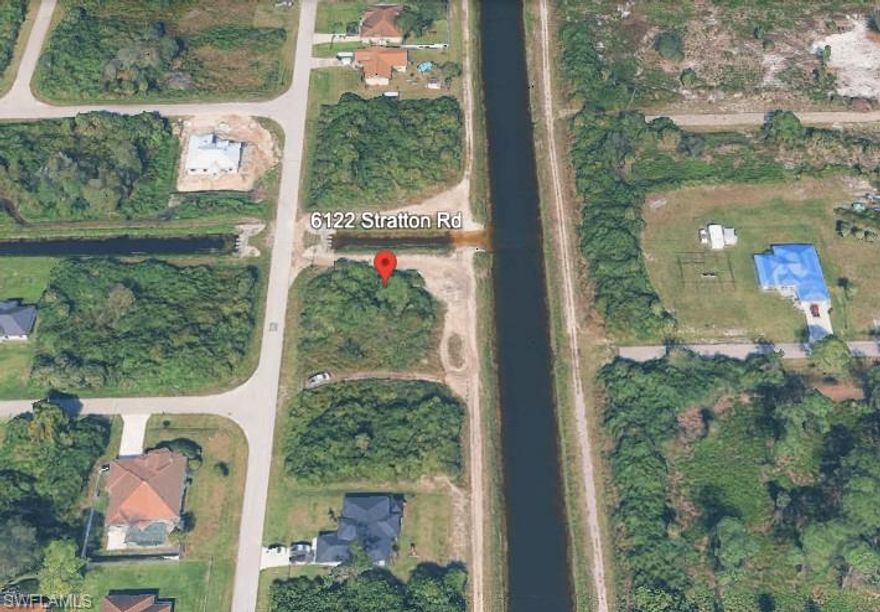 Residential lot located in a growing area of Lehigh Acres, offering a strong opportunity for builders and investors seeking added value beyond a standard interior parcel.

Situated near a canal corridor, this property provides increased spacing and a more open feel compared to surrounding lots—an advantage not commonly found at this price point.

Located within a platted subdivision with no HOA restrictions, this buildable lot offers a straightforward path to development. Electric is available nearby, and the property will require well and septic (standard for the area).

With ongoing residential development and strong builder activity in the area, this parcel presents an excellent opportunity for new construction or long-term investment.

Priced to reflect location advantages—submit your offer today.