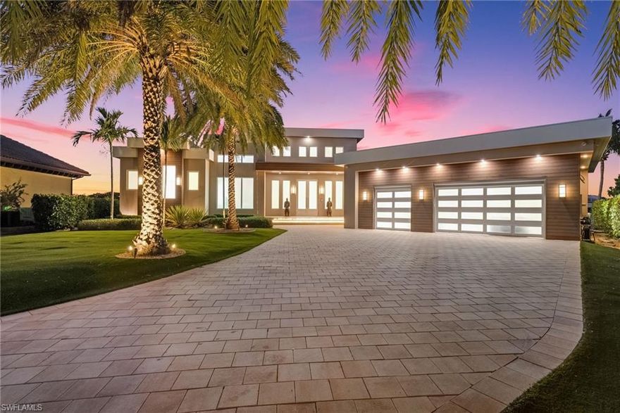 Welcome to one of Fort Myers’ most striking contemporary waterfront estates - where bold architecture meets a true yachter’s lifestyle. Set on nearly half an acre, this extraordinary residence spans over 7600 total square feet (with 6,200 square feet under air) and is curated with uncompromising finishes, including Italian porcelain flooring throughout and custom Poggenpohl cabinetry seamlessly carried across the home. Adding an elevated designer touch, Lalique glass fixtures are featured throughout, bringing artful elegance to every space.
A 271-foot wrap-around dock with two floating docks, a 40,000 pound boat lift, room for an 80 foot yacht,  and direct Gulf access places you in a boater’s dream setting - tucked within a private, quiet idle-speed zone for calm waters and effortless departures. Outside, the estate transforms into a resort-style retreat with a mega entertainment deck, expansive outdoor living areas, and dramatic accordion impact-glass doors that open wide to fully embrace true indoor-outdoor living. Enjoy a showstopping zero-edge pool and spa, a dedicated party room, and an incredible award winning Crestron sound and lighting system that makes entertaining (and everyday living) seamless.
Inside, the home is inspired by contemporary design at its finest - featuring 20-foot soaring ceilings, luminous open living spaces, and refined architectural details throughout. The chef’s kitchen is a statement in both style and performance with high-end Miele appliances, quartz countertops, and added convenience like instant hot and cold water. A striking glass wine room and a custom bar area, complete with an al fresco gas grill, set the stage for unforgettable gatherings.
The layout is thoughtfully arranged for privacy: the primary suite, flex room, and gallery occupy the west wing, while guest accommodations are positioned in the east. The primary bath feels like a private spa, featuring a large soaking tub, walk-in shower, heated towel rack, and a TV built into the mirror for the ultimate in luxury and comfort.
Completing the experience is a rare 5-car garage, offering ample space for vehicles, toys, and storage. Perfectly positioned near everything that matters - approximately 15 minutes to the private airport, 20 minutes to the international airport, and close to fine dining, shopping, and area beaches - this is not just a home, it’s a destination.