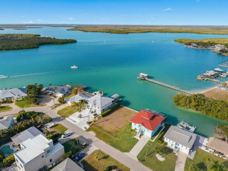 Exceptional opportunity to build your dream home on one of Naples' finest waterfront homesites!  Enjoy wide-open views of Johnson Bay and quick, direct access to the Gulf.  This prime location allows you to explore the Ten Thousand Islands, experience world-class fishing, and enjoy the white sand beach of Keewaydin Island all within minutes.  Design your very own coastal oasis on this gorgeous homesite, taking advantage of the spectacular bay views.  Enjoy the tranquility of island life while watching dolphins and manatees play from your backyard.  The homesite is perfectly situated on Isles of Capri with the restaurants, marina, and community center all close by. Charming Isles of Capri is ideally located between Marco Island and downtown Naples.
